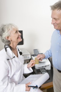 Senior medical practitioner and clipboard
